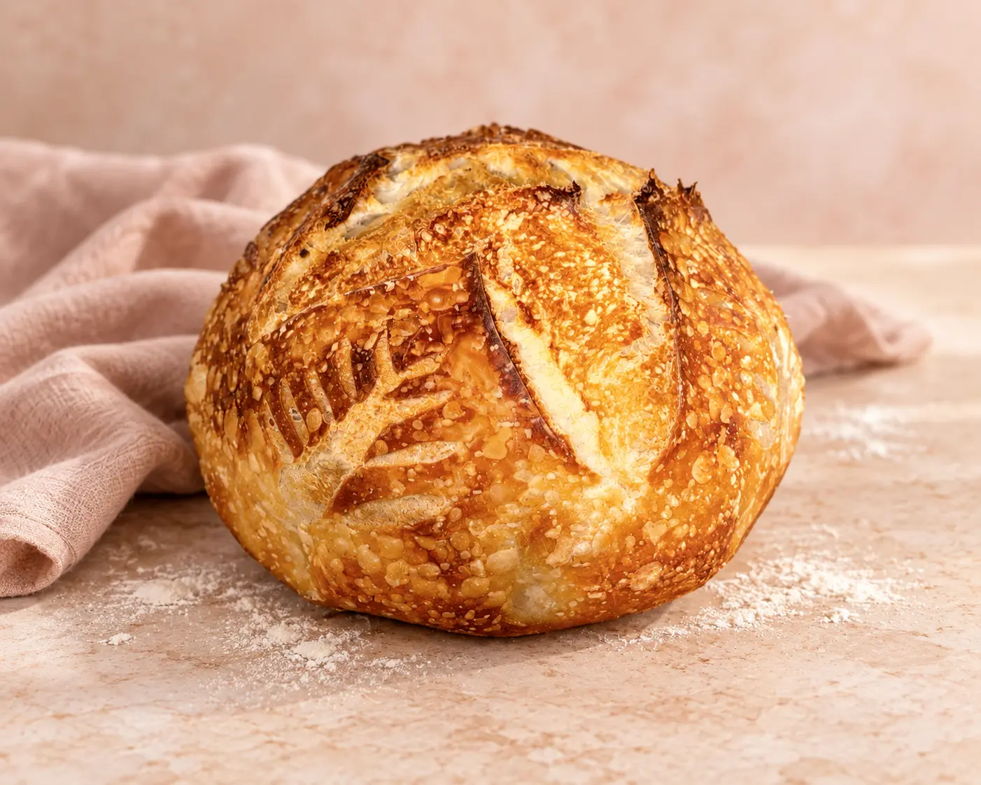 Freshly baked Gooey Goodies sourdough loaf with a golden crust